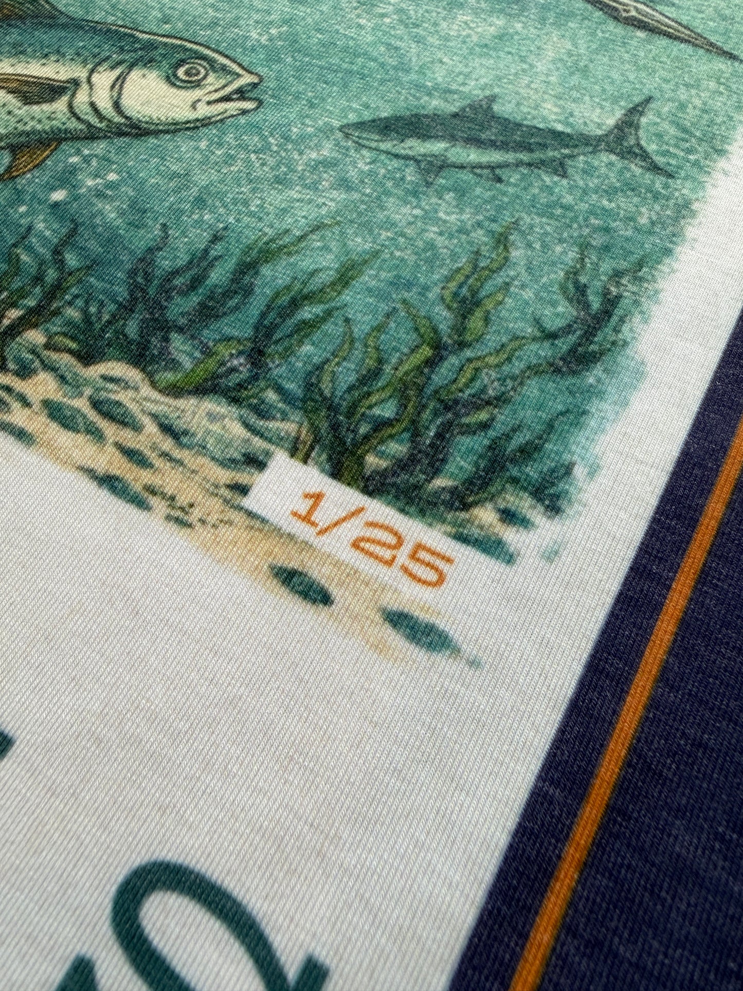 Ghost Series Close-up of a fabric with fish design and numbered label