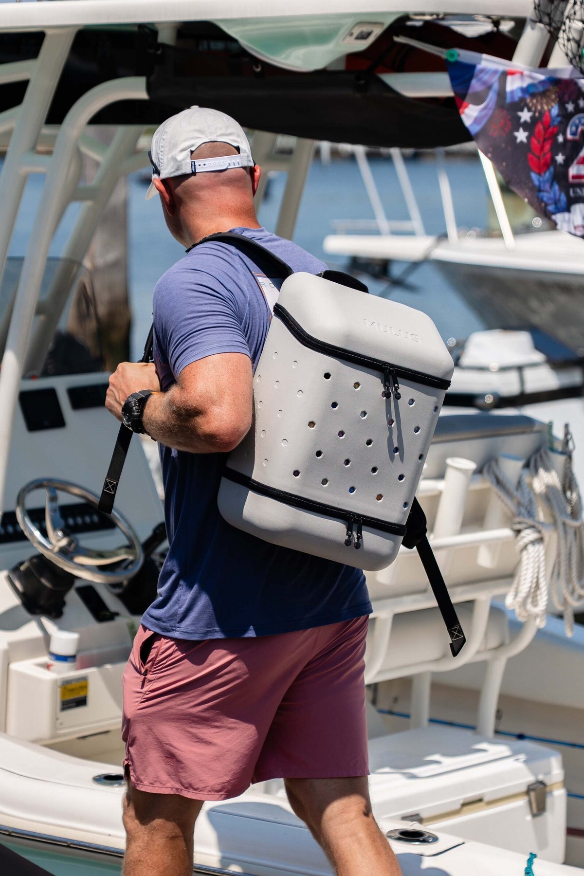 Ash Gray MULUS ROAMER backpack carried onto a boat